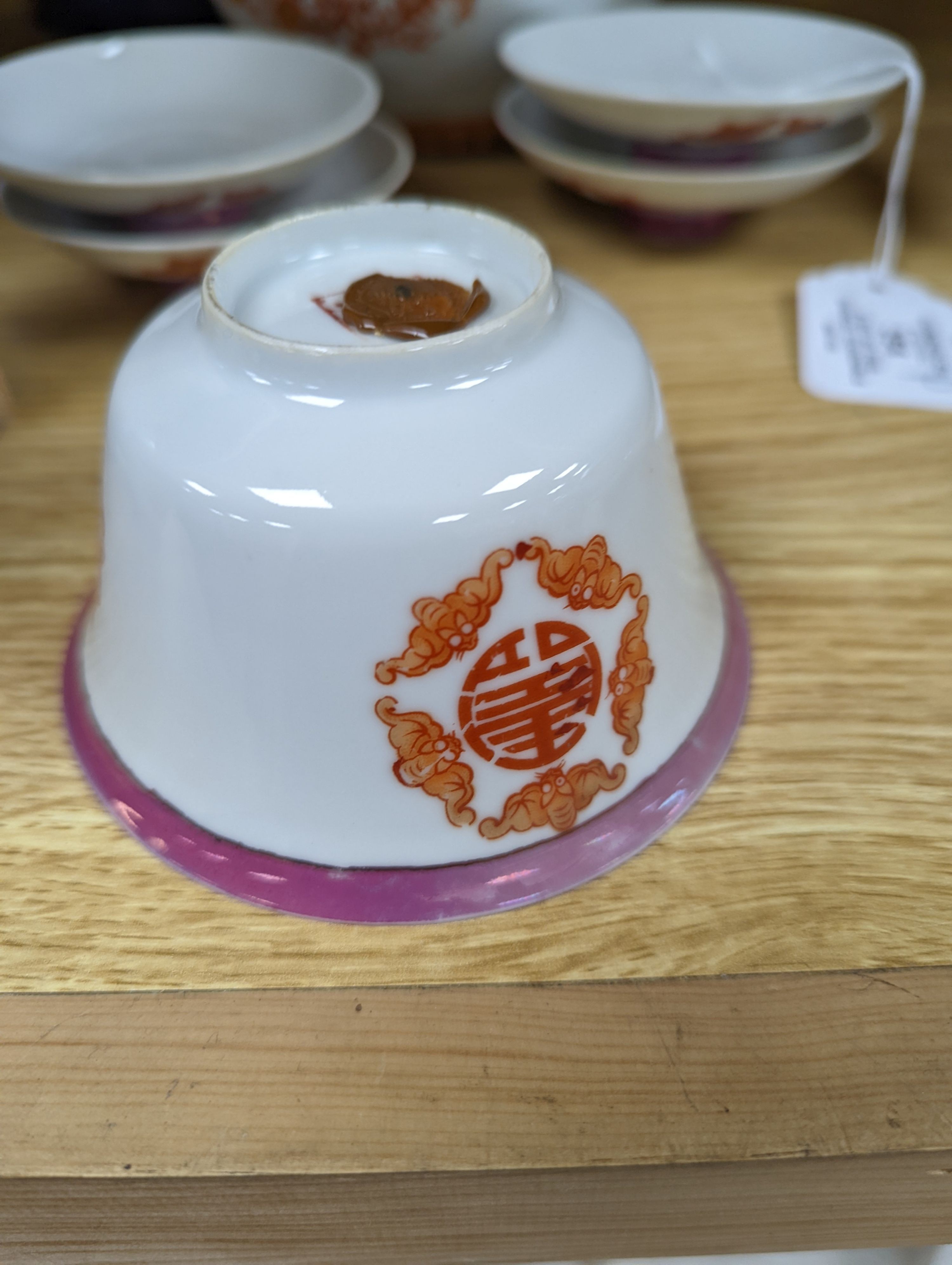 A set of five Chinese teabowls, covers and stands and a similar 'dragon' vase, 23cm